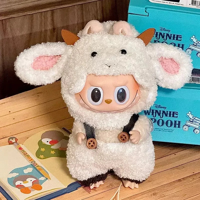 Plush toy in a sheep costume on a wooden floor with a Winnie the Pooh box in the background.
