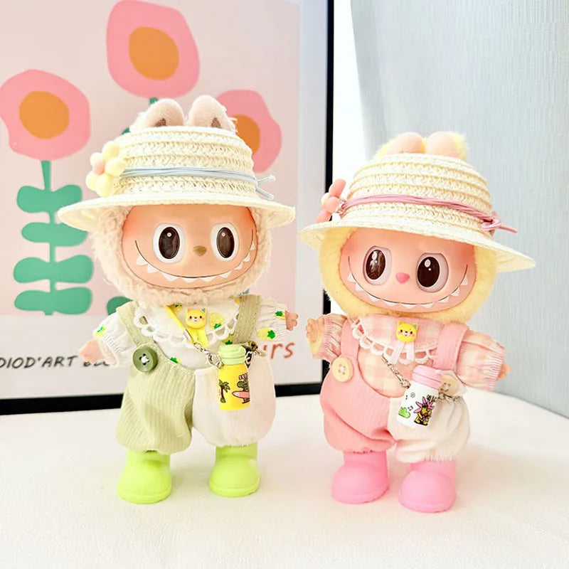 Two cartoon character figurines wearing hats against a light background