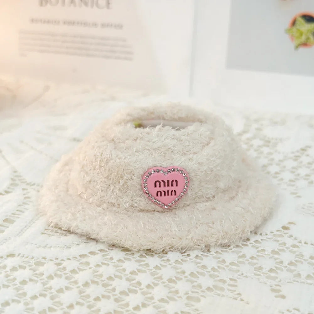 Coconut with a pink heart-shaped label on a textured surface