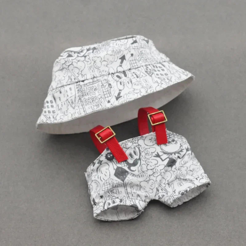 Children's hat and shorts set with red straps on a gray background