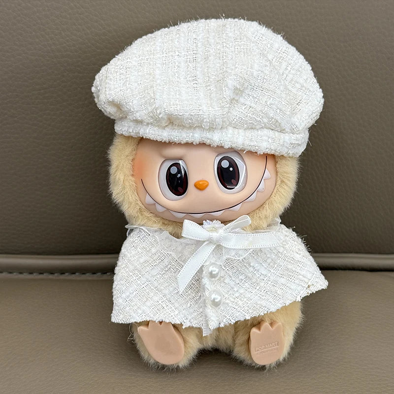 Stuffed toy with a white hat and coat on a brown surface