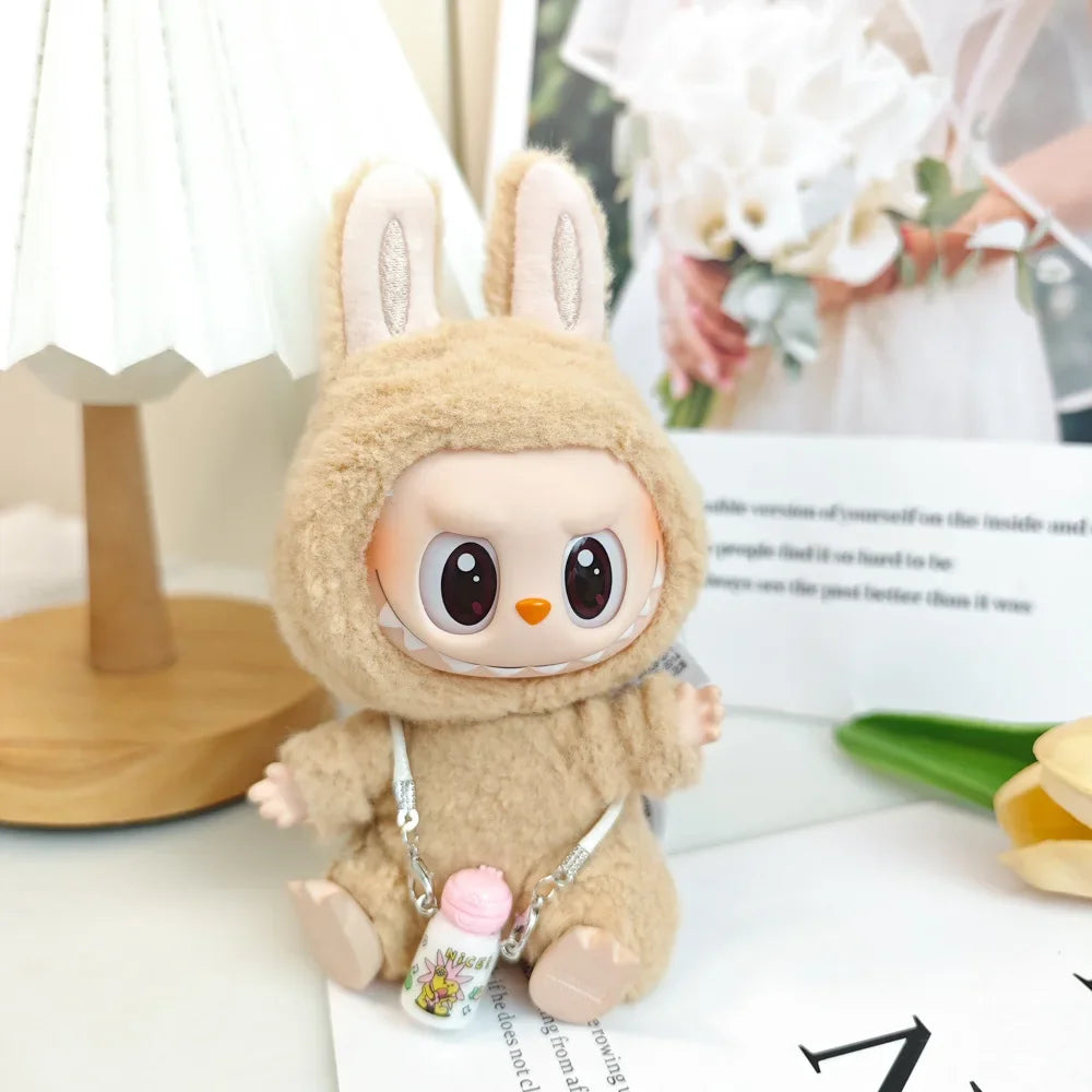 Plush toy with rabbit ears and a small backpack on a surface with blurred background