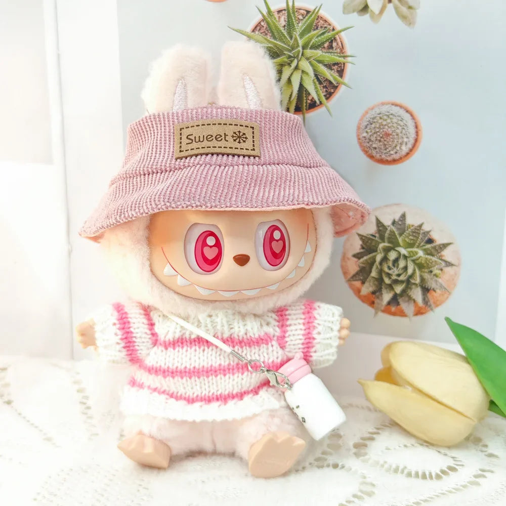 Stuffed animal toy with a pink hat and striped sweater, surrounded by plants and flowers.