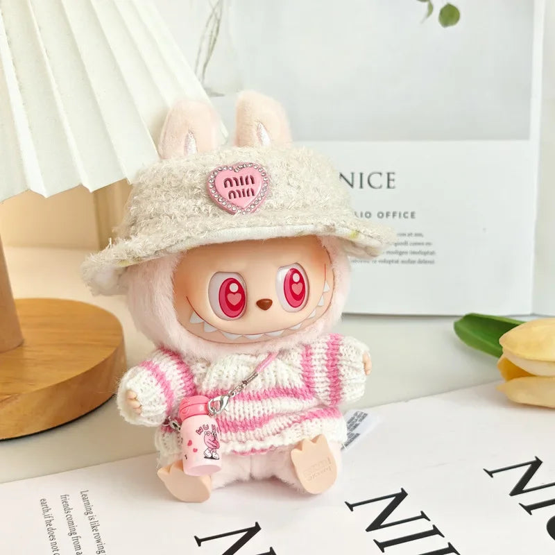 Kawaii plush toy with a hat and pink outfit on a white surface