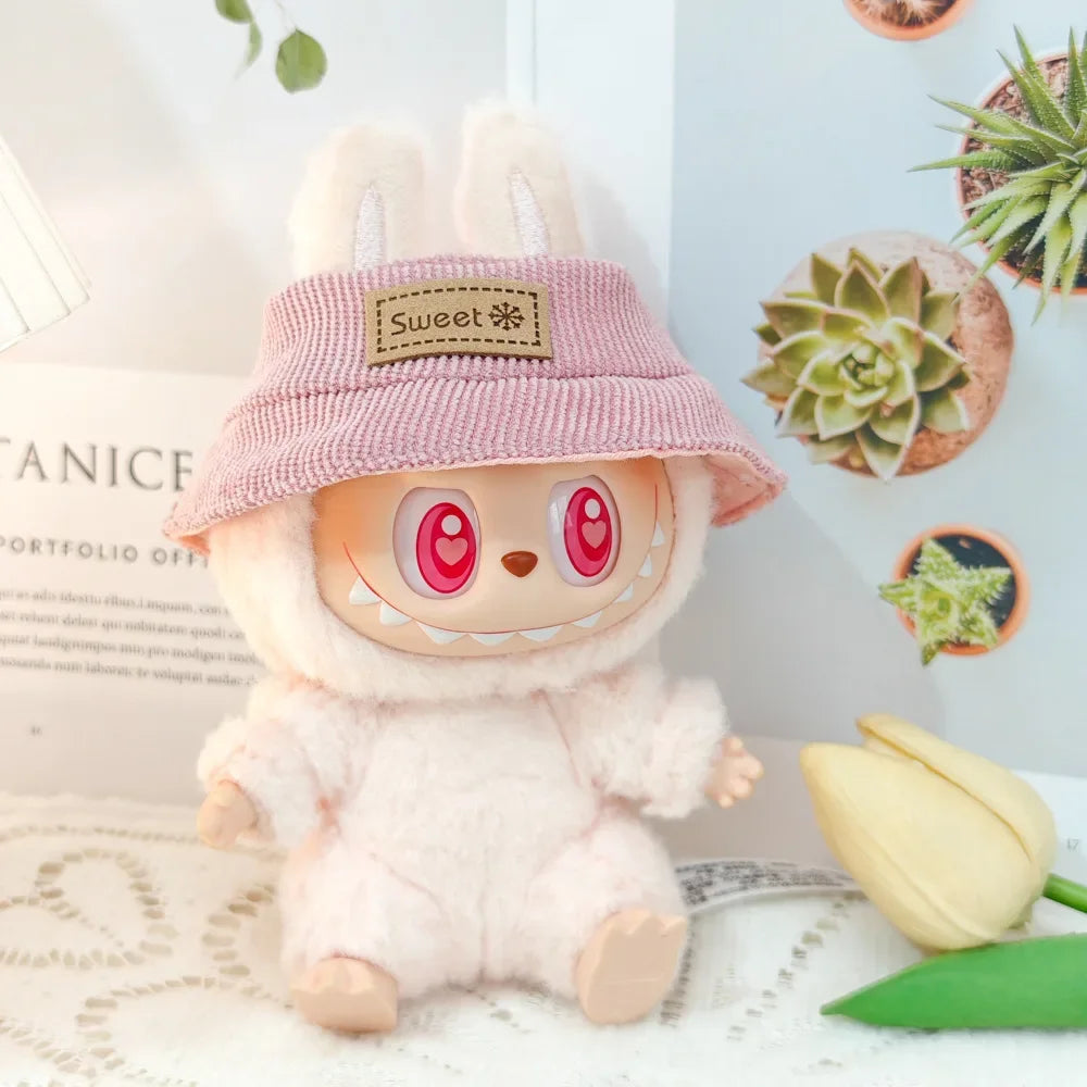 Plush toy with a pink hat labeled 'Sweet' on a decorative background with plants and tulips.