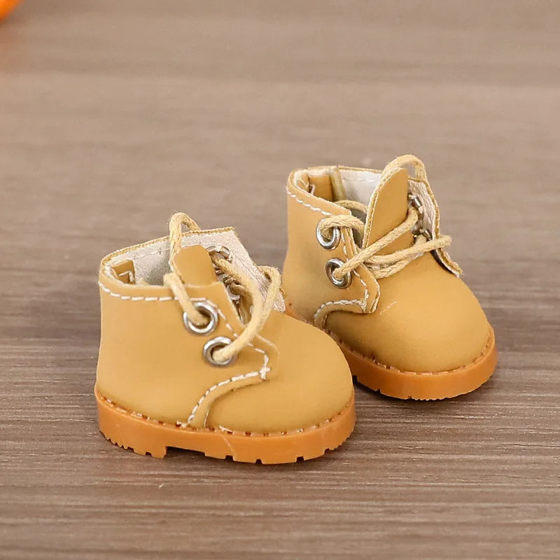 Pair of yellow children's boots on a wooden surface