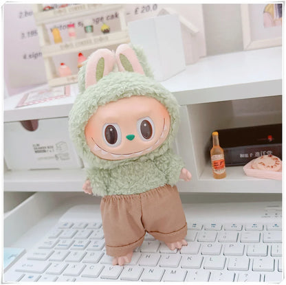Plush toy with bunny ears on a laptop keyboard