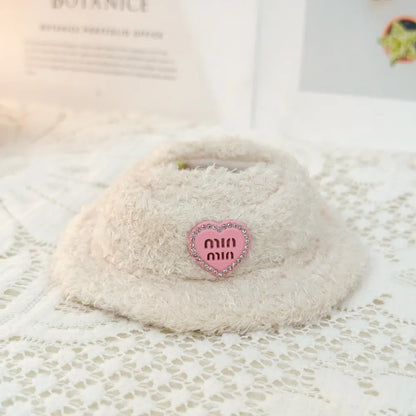Coconut with a pink heart-shaped label on a textured surface