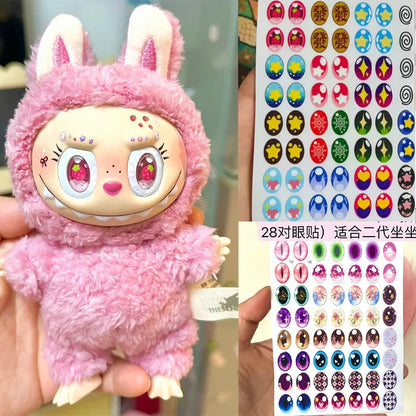 Pink plush toy with bunny ears and a sheet of colorful stickers.