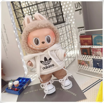Plush toy in a bunny costume with Adidas hoodie on a desk