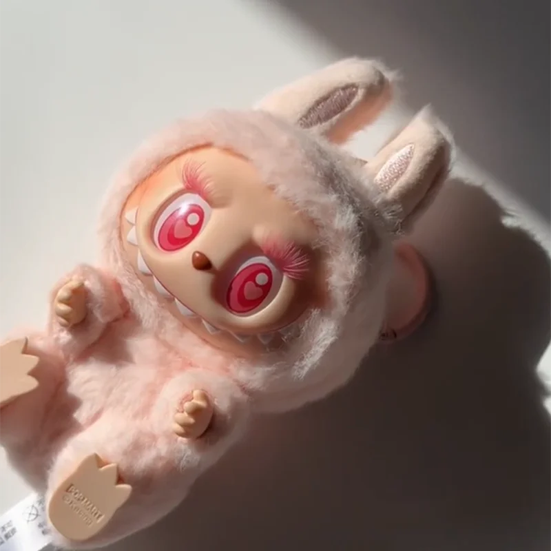 Cute plush toy with large red eyes on a light background