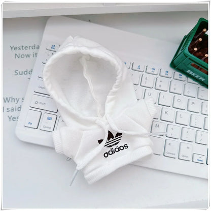 White Adidas headband on a keyboard with a blurred background