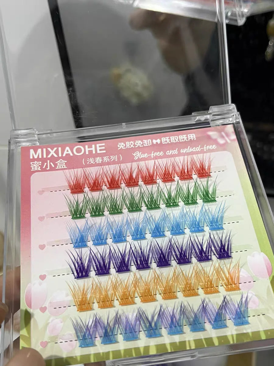 MIXIAOHE false eyelash set with colorful lashes in a clear case.