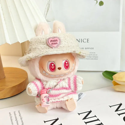 Kawaii plush toy with a hat and pink outfit on a white surface