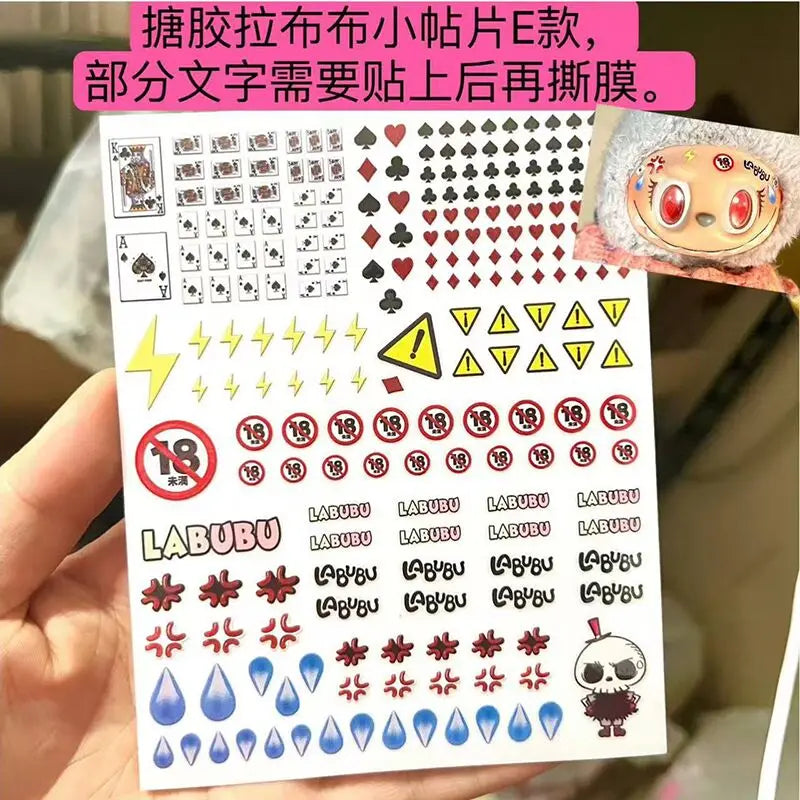 Sheet of stickers with various designs held by a hand, featuring the brand 'LABUBU'.