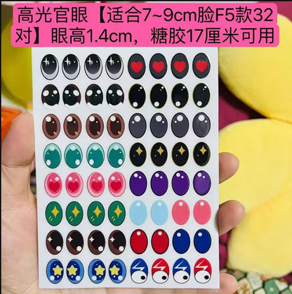 Sheet of colorful eye stickers held by a hand with a multicolored background